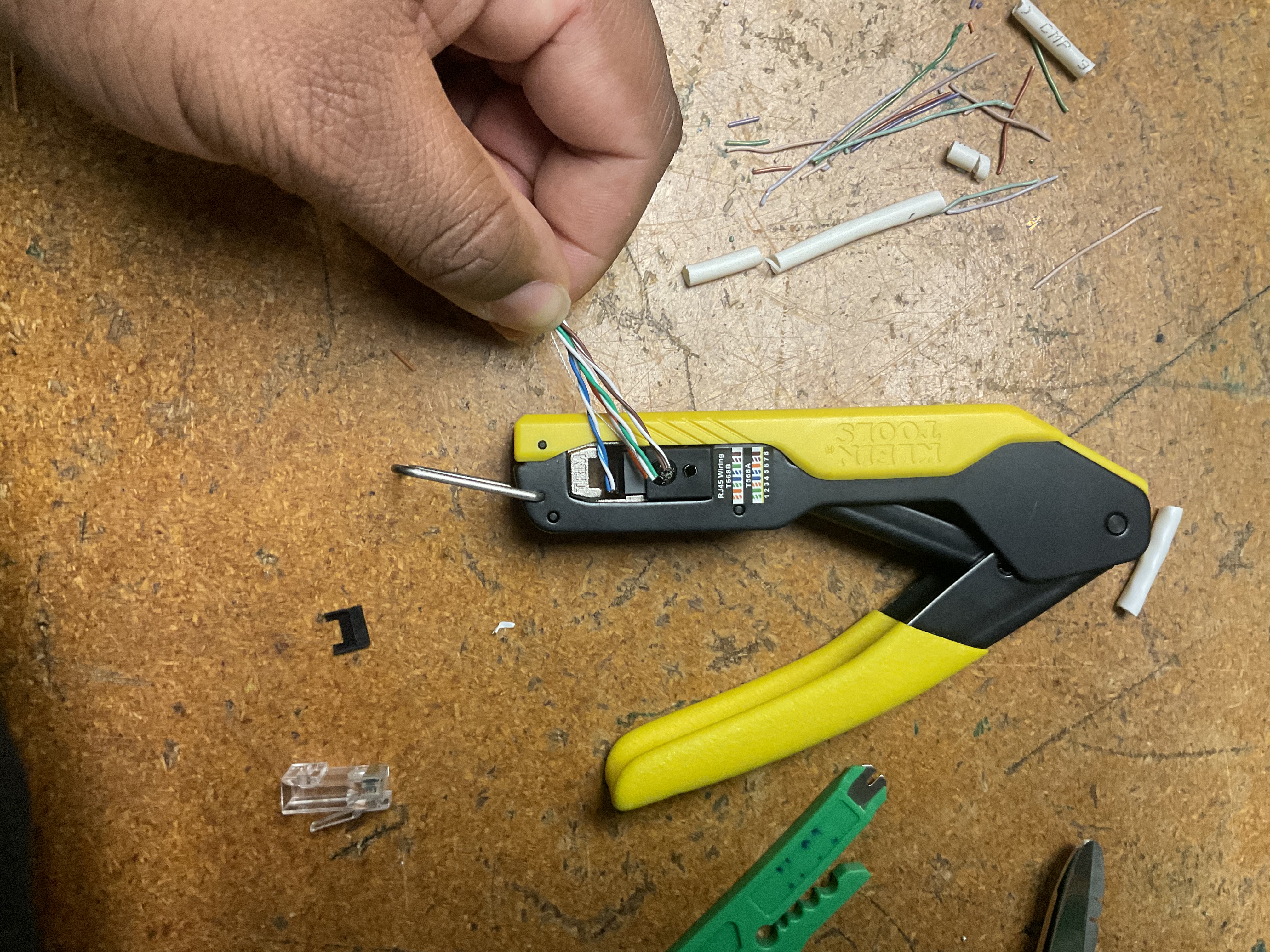 Hand guiding conductors into Klein crimper