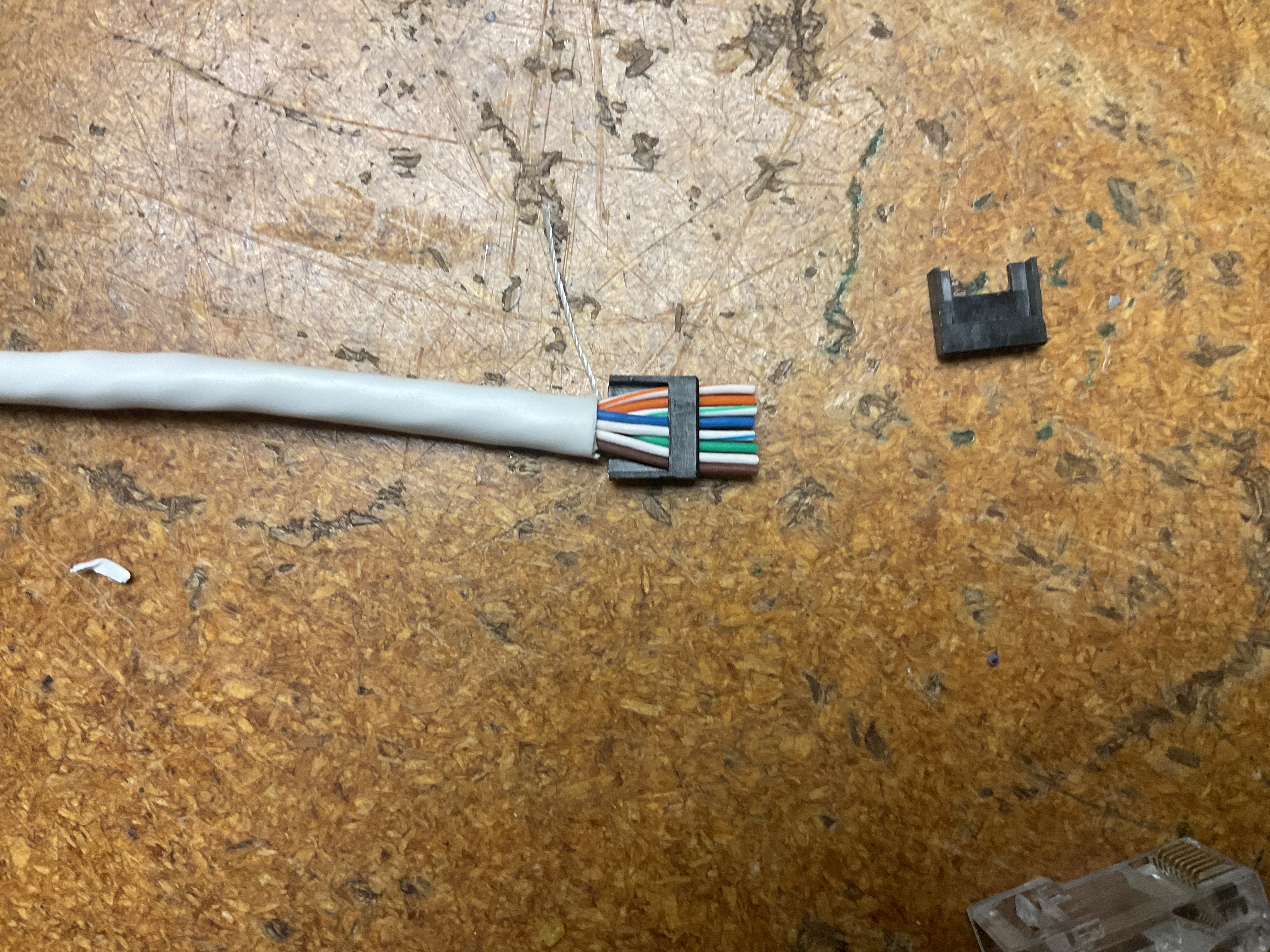 Conductors aligned before crimp with strain relief clip