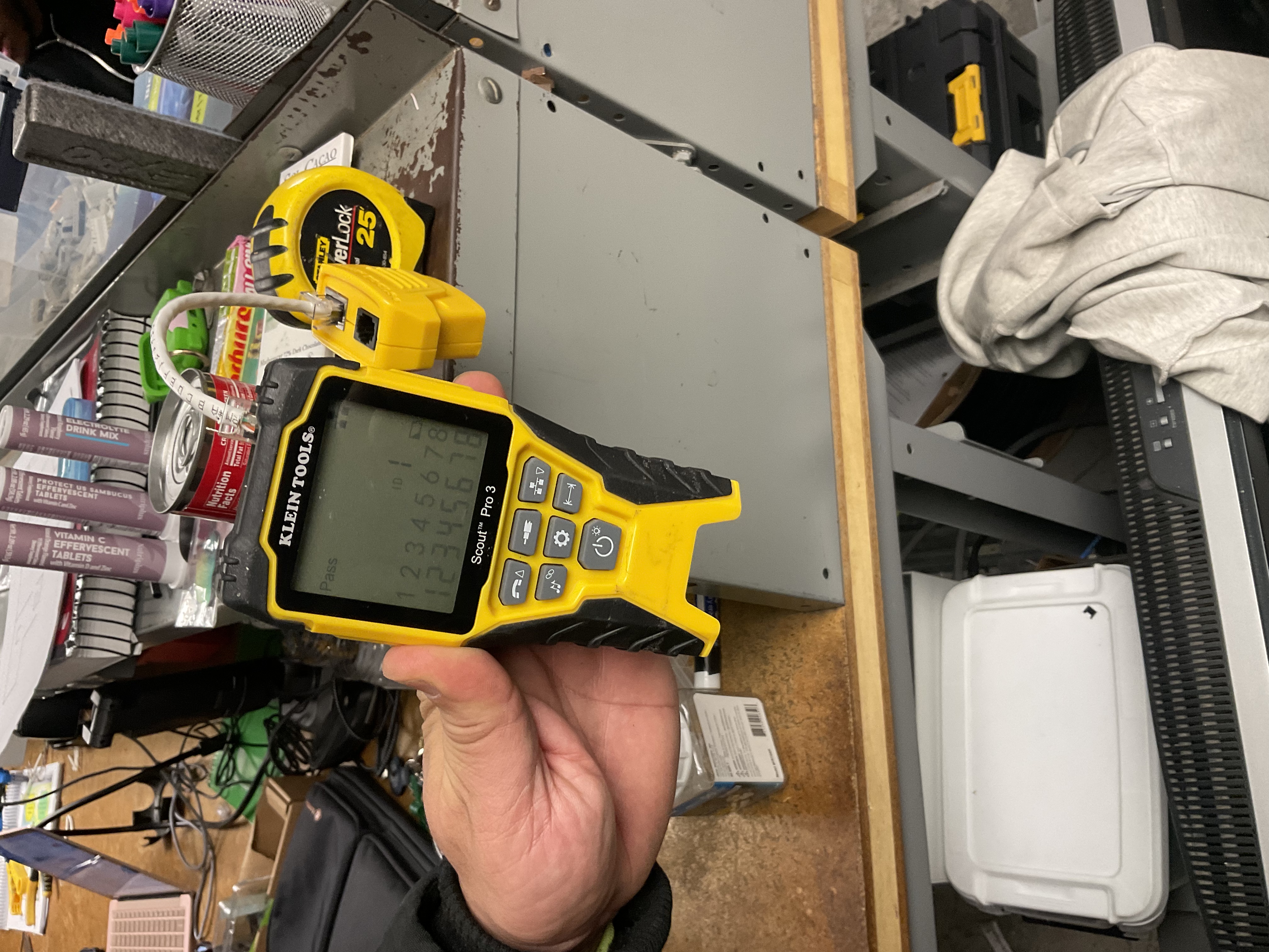 Klein Scout Pro 3 cable tester held in hand